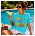 Woman in a 'Margarita Weather' t-shirt holding a margarita by a pool.