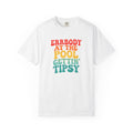 White t-shirt with colorful text design on a white background