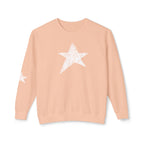 A peach-colored crewneck sweatshirt featuring a large white star graphic on the chest and a smaller matching star on the left sleeve, displayed against a clean white background.
