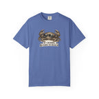 A blue short-sleeve crewneck t-shirt featuring a graphic of a crab and the text 'IF CRABBY, RETURN TO BEACH' printed on the chest, displayed against a plain white background.