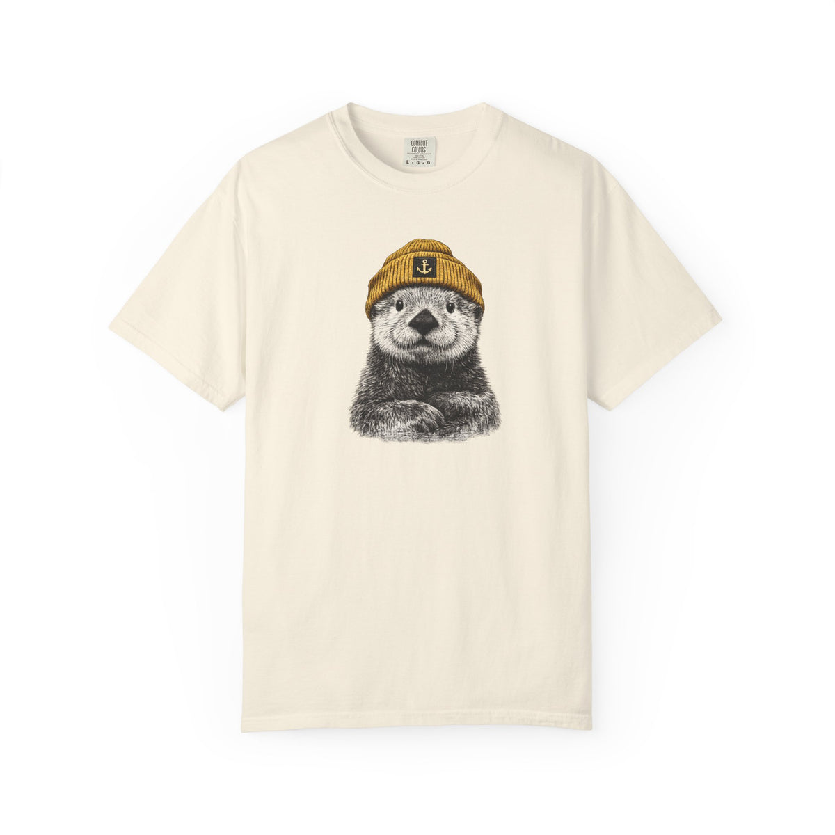 Beige t-shirt with a graphic of an otter wearing a cap on a white background