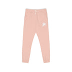 Light pink jogger pants with a white drawstring and a white star graphic on the left thigh, shown against a plain white background.