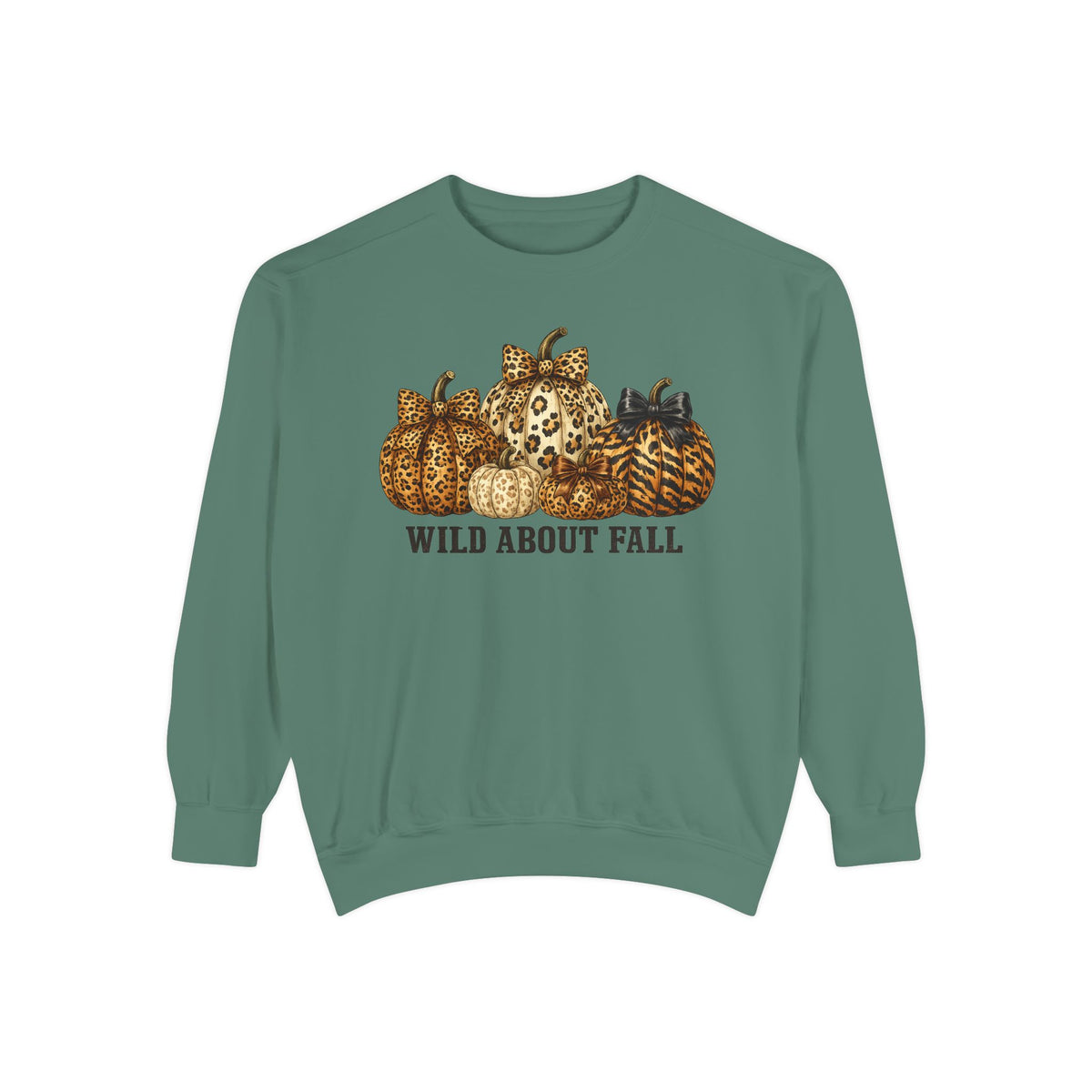 A sage green crewneck sweatshirt featuring a graphic of patterned pumpkins and the text 'WILD ABOUT FALL' printed on the chest, displayed against a solid white background.