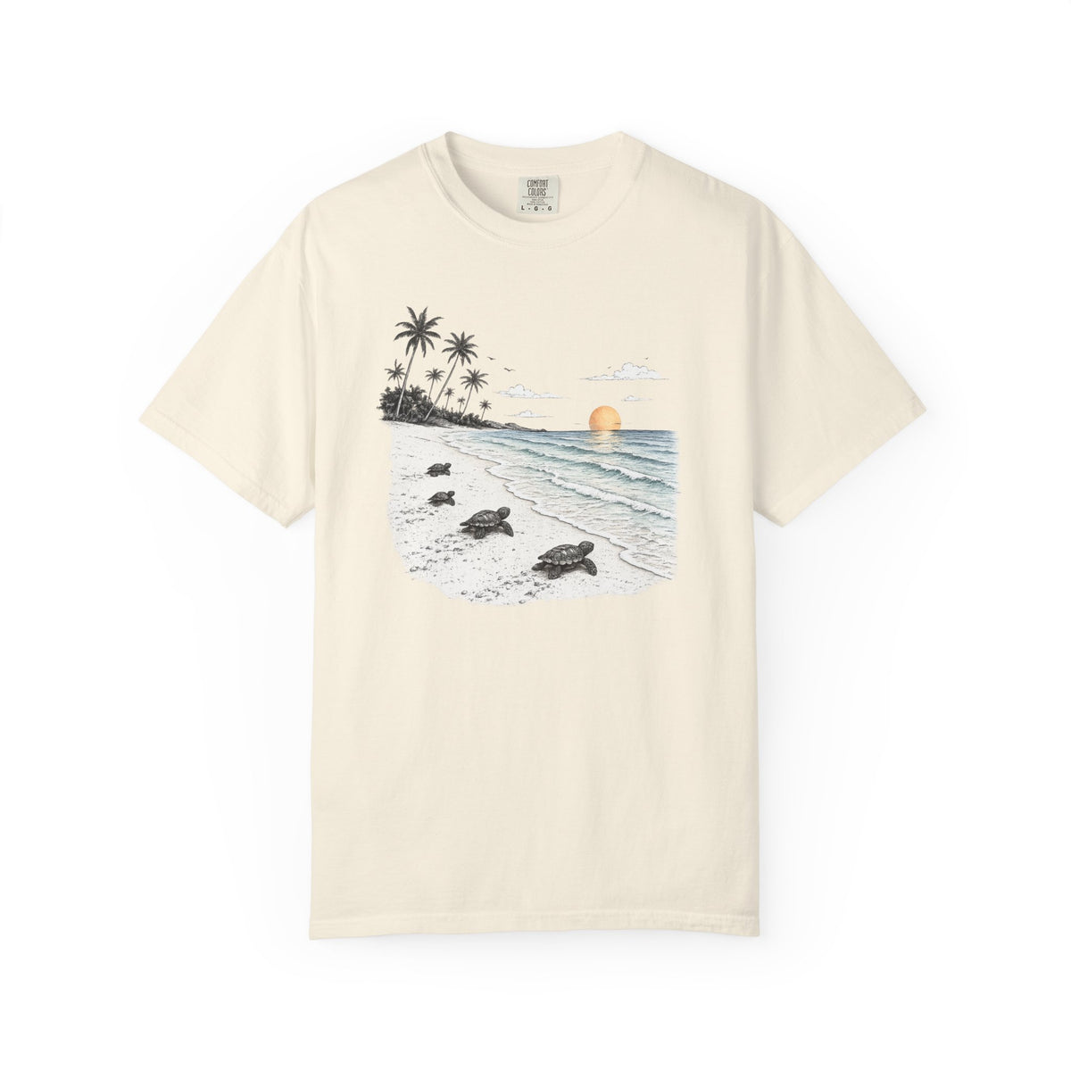 An off-white short-sleeve crewneck t-shirt featuring a central graphic print of a tropical beach scene with palm trees, sea turtles on the sand, and a sunset over the ocean.