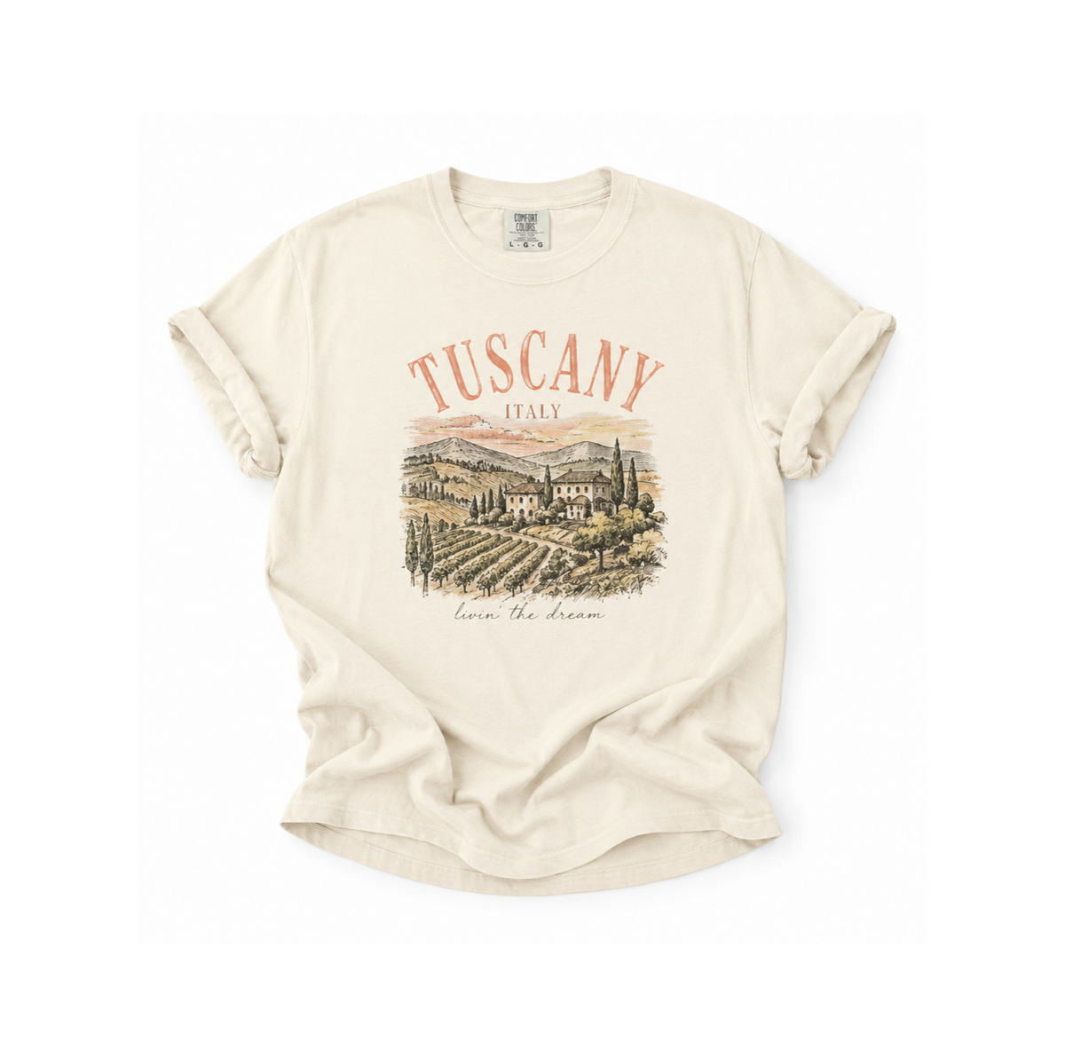 Beige t-shirt with 'Tuscany, Italy' graphic on a white background